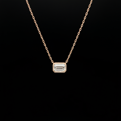 Emerald cut diamond necklace black background