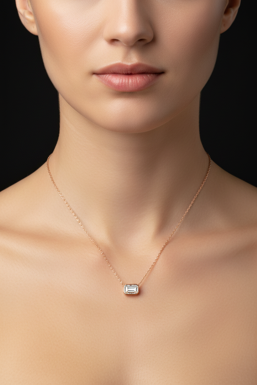 Model wearing emerald cut diamond necklace